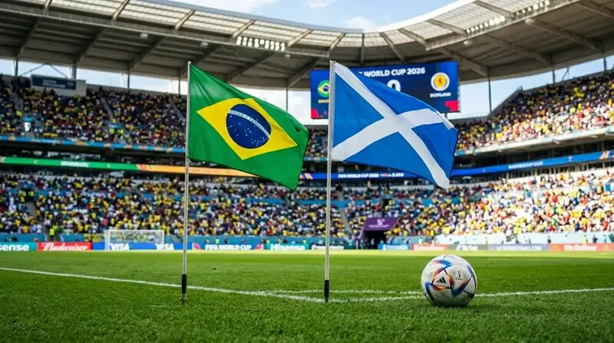 Brazil and Scotland flags beside a World Cup match ball on a sunlit stadium pitch